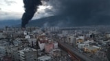 TURKEY -- Black smoke from a fire rises over central Iskenderun