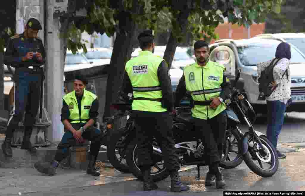 Unidentified policemen on a street corner in Tehran on July 16. The absence of morality police on the streets during and after the massive protests, and a vague statement from an Iranian official, led to false reports in Western media that the unit had been disbanded.