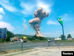 An explosion is seen at the Bereta Trading facility near the eastern Bulgarian town of Straldzha on June 5, 2012.