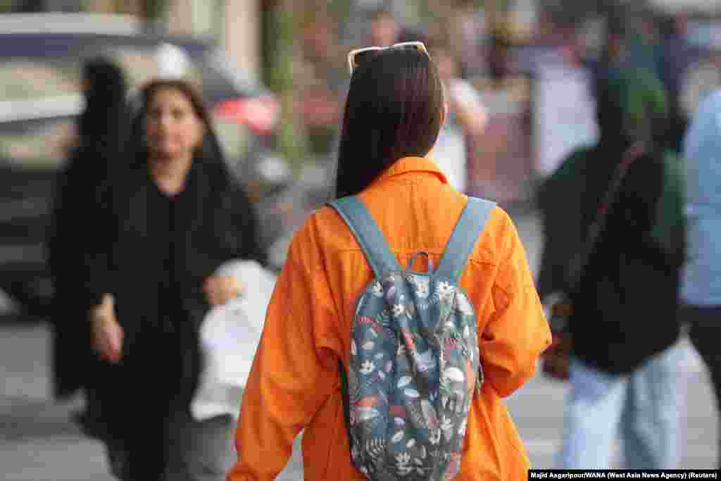 A woman goes without the mandatory hijab in Tehran on July 16. An Iranian official on July 16 confirmed that patrols of the notorious morality police, known officially as Guidance Patrols, have returned to Iran&rsquo;s streets after months of keeping a low profile. The patrols&nbsp;enforce laws around clothing and behavior between the sexes. &nbsp;