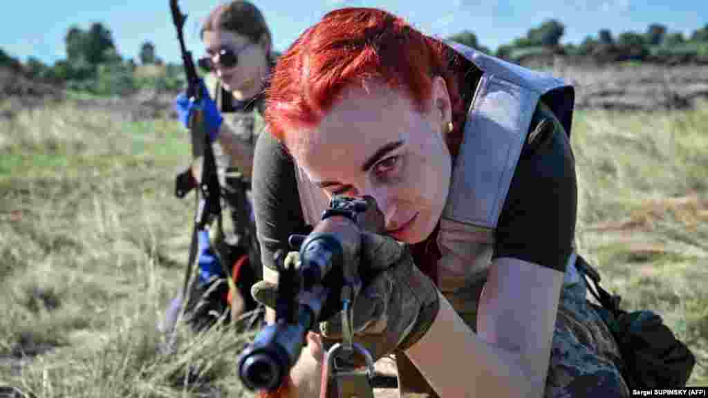 Ukrainian cadets, wearing new military uniforms, take part in a training exercise on the outskirts of Kyiv on July 12. The event was to simulate combat conditions in specially designed clothing that is suited for female fighters.