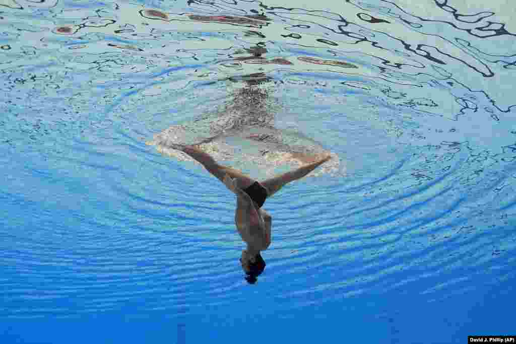 Eduard Kim of Kazakhstan competes in the men&#39;s solo free artistic swimming at the World Swimming Championships in Fukuoka, Japan.