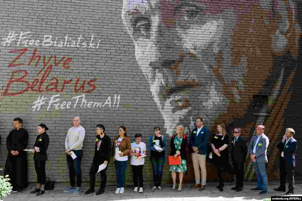 It took more than an hour for the names of Belarusian political prisoners to be read aloud near a mural of Ales Byalyatski&nbsp;in Vilnius, Lithuania, on May 21 during&nbsp;the Day Of Solidarity With Political Prisoners In Belarus. Byalyatski, a Belarusian pro-democracy activist who was sentenced to prison in what Amnesty International called a &quot;blatant act of injustice,&quot; was awarded the 2022 Nobel Peace Prize. &nbsp;