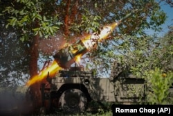 Ukrainian soldiers fire a multiple-rocket launcher toward Russian positions on the front line near Bakhmut on July 10.