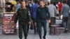 Two policemen walk through Tehran on July 16. The officer on the left is wearing the standard green uniform&nbsp;<strong><a href=future-of-irans-morality-police-unclear-after-official-said-force-was-closed_.html target="_blank">that is worn</a></strong>&nbsp;by units of the morality police.<br />
<br />
&nbsp;