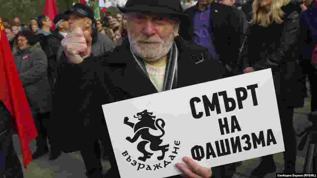 Yolo Denev, who ran for president of Bulgaria in 2021, holds a sign vowing &ldquo;Death to Fascism&rdquo; during the protest. Bulgaria&rsquo;s acting Prime Minister Galab Donev said any government action on the monument should be taken after the upcoming parliamentary elections on April 2 &ldquo;so the proper decision can be made in a calm environment.&rdquo;