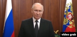 Russian President Vladimir Putin delivers a televised address to the nation on June 24.