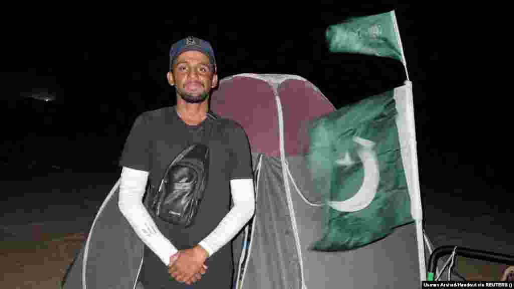 After crossing over from the United Arab Emirates into Saudi Arabia, Arshad poses for a picture near his tent and the national flag of Pakistan. &quot;On several occasions, there were deserted roads, where there was no city or village, but what kept me going and my morale high were the people that I encountered on these routes, who encouraged me and pushed me to complete this journey smoothly,&quot; he said.