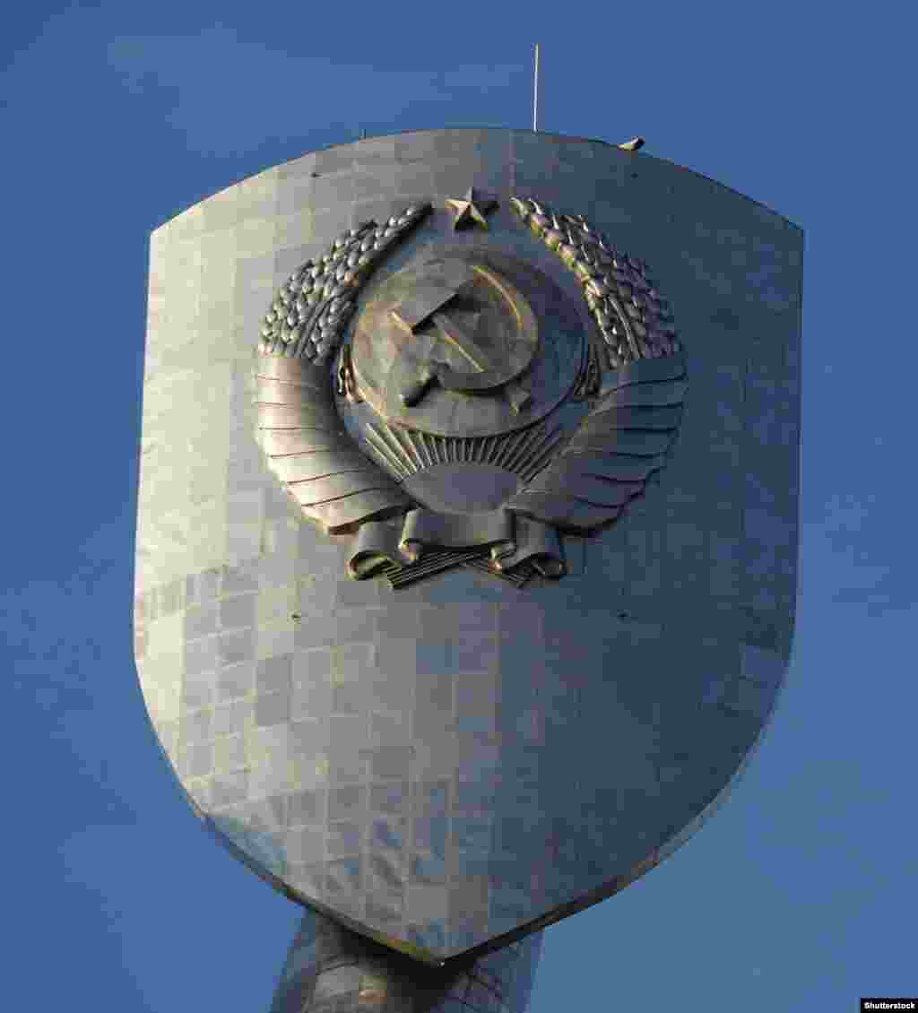 The current steel shield of the monument features the Soviet coat of arms. Ukrainian activists have long called for the removal of the communist emblem. A survey held in 2022 reported some 85 percent of Ukrainians wanted the hammer and sickle replaced with a trident -- Ukraine&#39;s official coat of arms.