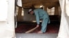 A man cleans an empty educational facility set up by UNICEF after it was closed on April 16 on the orders of the Taliban government in Kandahar, Afghanistan.
