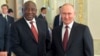 Russian President Vladimir Putin (right) meets with his South African counterpart, Cyril Ramaphosa, in St. Petersburg last month. 