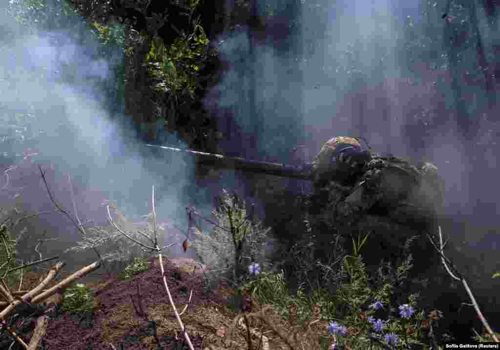 A Ukrainian soldier of the 10th Separate Mountain Assault Brigade fires an anti-tank grenade launcher at his position at a front line near the city of Bakhmut in the Donetsk region, Ukraine.