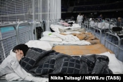 Residents of Shebekino take refuge in a temporary accommodation facility in the Belgorod Arena.