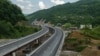 A new stretch of road cuts through the Rikoti Pass in central Georgia. The entire 51.6-kilometer project will consist of 96 bridges, 53 tunnels, and cost nearly $1 billion.