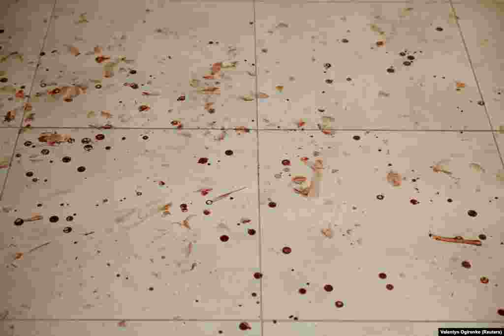 Blood is seen on the floor of an apartment building damaged during the drone attack.