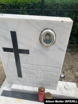 The grave of 12-year-old Florin Negru at the Heroes Cemetery in Brasov.