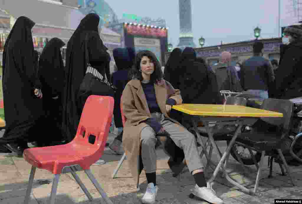 An Iranian woman sits on a chair in front of a busy square in Tehran, defying the mandatory hijab law, on December 27, 2022. &ldquo;A few days after Mahsa&rsquo;s death, I was walking past Keshavarzi Boulevard when I saw a massive crowd of men and women, young and old, chanting a slogan that I&rsquo;ve never heard before: &lsquo;Woman, Life, Freedom.&rsquo; It enlightened me; it was moving,&rdquo; she said. World Press Photo Asia Honorable Mention: Ahmad Halabisaz
