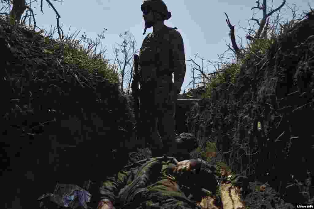 A Ukrainian soldier stands above a dead Russian soldier in a recently captured trench near Bakhmut, in eastern Ukraine, on July 4. Kyiv&#39;s counteroffensive against Russian forces has been &quot;particularly fruitful&quot; in the past few days, Oleksiy Danilov, secretary of Ukraine&#39;s National Security and Defense Council, said on July 5. His comments come after Ukrainian President Volodymyr Zelenskiy said on July 4 that his troops had made progress after a &quot;difficult&quot; week.
