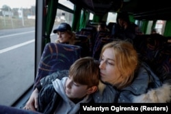 Alla Yatsentiuk embraces her 14-year-old son, Danylo, in the Volyn region of Ukraine on April 7. Like many others, Danylo went to a Russian children's camp in Crimea and was taken to Russia without his family's permission.
