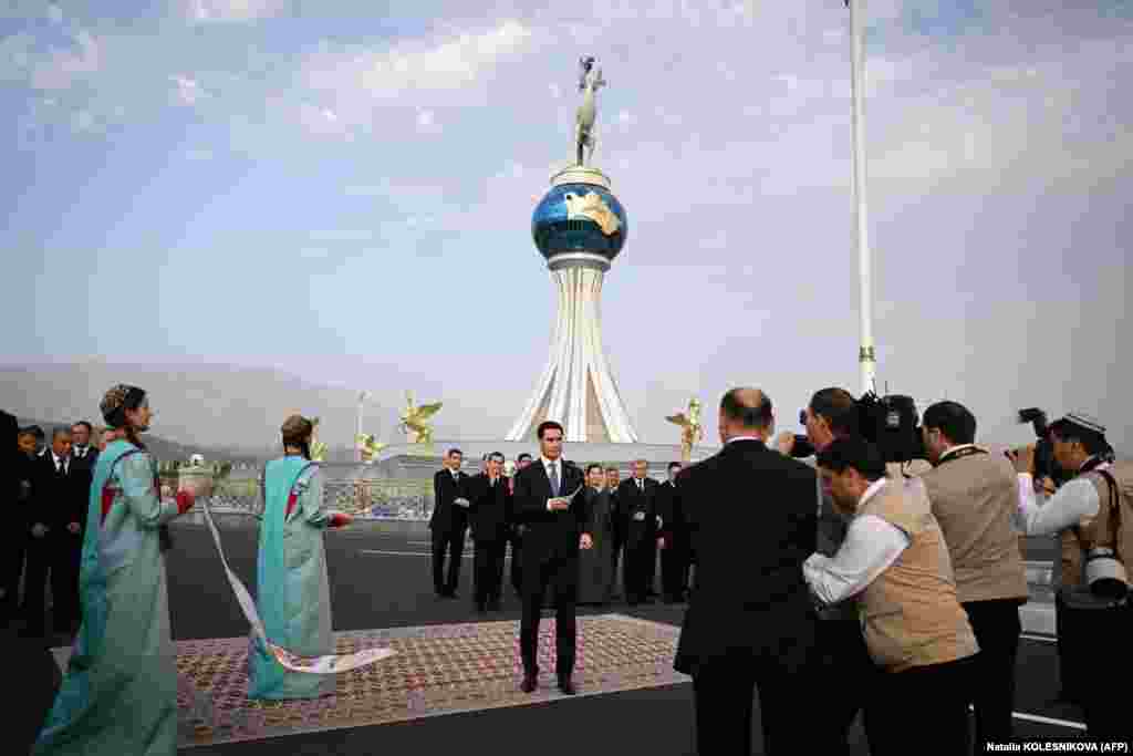 Turkmen President Serdar Berdymukhammedov, 41, cuts the ceremonial ribbon inaugurating the new city of Arkadag.&nbsp; Despite the pomp in his honor, the elder Berdymukhammedov was not in attendance and was in&nbsp;Saudi Arabia making the hajj pilgrimage.