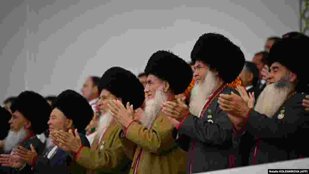 Aksakals -- male elders -- clap as they watch the festivities from the grandstand. Both the elder Berdymukhammedov and his predecessor, Saparmurat Niyazov, developed cults of personality that included elaborate tributes and monuments.