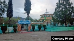 The Mai Toti shrine in the Pakistani village of Bandli, where worried residents have been gathering to pray for 28 local men who were lost when a boat capsized in the Mediterranean on June 14, leaving hundreds missing, feared dead. 