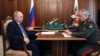 Russian President Vladimir Putin (left) attends a meeting with Defense Minister Sergei Shoigu in Moscow on April 17.