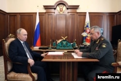 Putin attends a meeting with Defense Minister Sergei Shoigu in Moscow on April 17.