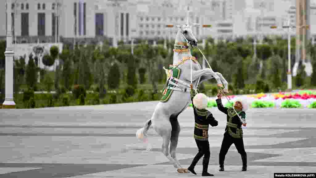 Jockeys perform with a horse during the inauguration ceremony.&nbsp; &nbsp;