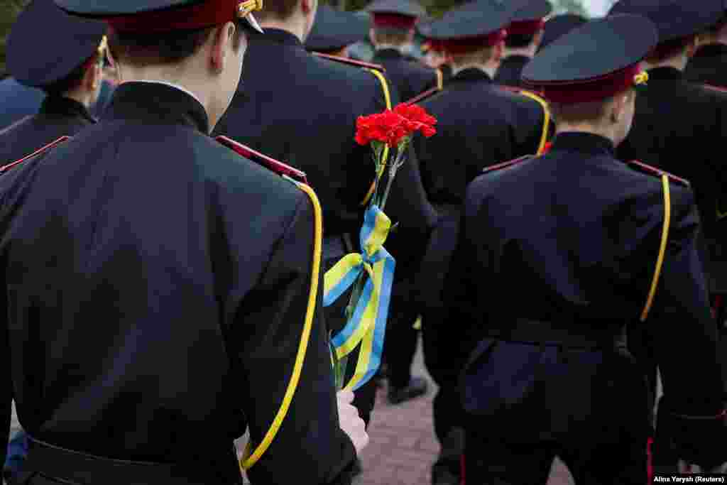In the Ukrainian capital, Kyiv, cadets attend a ceremony for those killed in the 1986 Chernobyl nuclear accident.