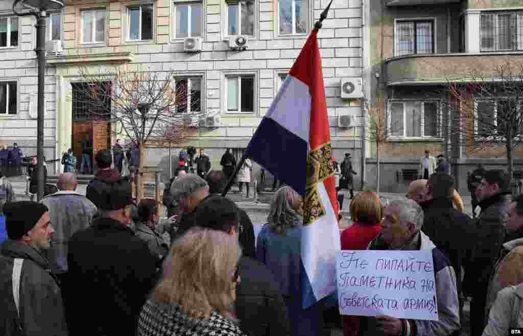 Protesters also gathered outside Sofia&rsquo;s Municipal Council on March 9. This picture shows one demonstrator holding a Samara flag, referencing the Russo-Turkish War of the 1870s, as another man displays a sign saying, &quot;Don&#39;t touch the monument to the Soviet Army.&quot;&nbsp; During the council protest, a man threw a Ukrainian flag that had been flying from the balcony of the council building to the ground. Reactions online to the incident were largely critical, with even those against foreign flags flying from Bulgaria&rsquo;s official buildings saying it should have been removed respectfully.