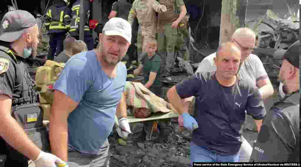 A body is recovered from the rubble by rescuers. The attack came&nbsp;as European Union officials convened in The Hague to discuss war crimes in Ukraine.