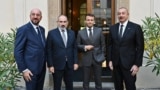 European Council President Charles Michel, Armenian Prime Minister Nikol Pashinian, French President Emmanuel Macron, and Azerbaijan President Ilham Aliyev meet in Prague on October 6, 2022. Days later, Macron gave an interview that set off an anti-France campaign in Azerbaijan after he called the 2020 conflict "a terrible war." 