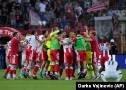 Red Star players celebrate after winning Serbia's National Cup final soccer match between Red Star and Partizan in Belgrade on May 26, 2022.