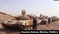 Russian troops and tanks take part in a drill near the Tajik-Afghan border in July 2021.
