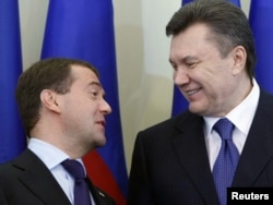 The material destroyed included an investigation into a controversial 2010 deal between former Ukrainian President Viktor Yanukovych (right) and former Russian President Dmitry Medvedev.