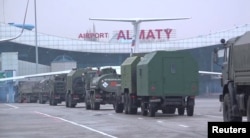 Russian military vehicles arrive at Almaty airport as part of a peacekeeping mission of the Collective Security Treaty Organization on January 9, 2022.