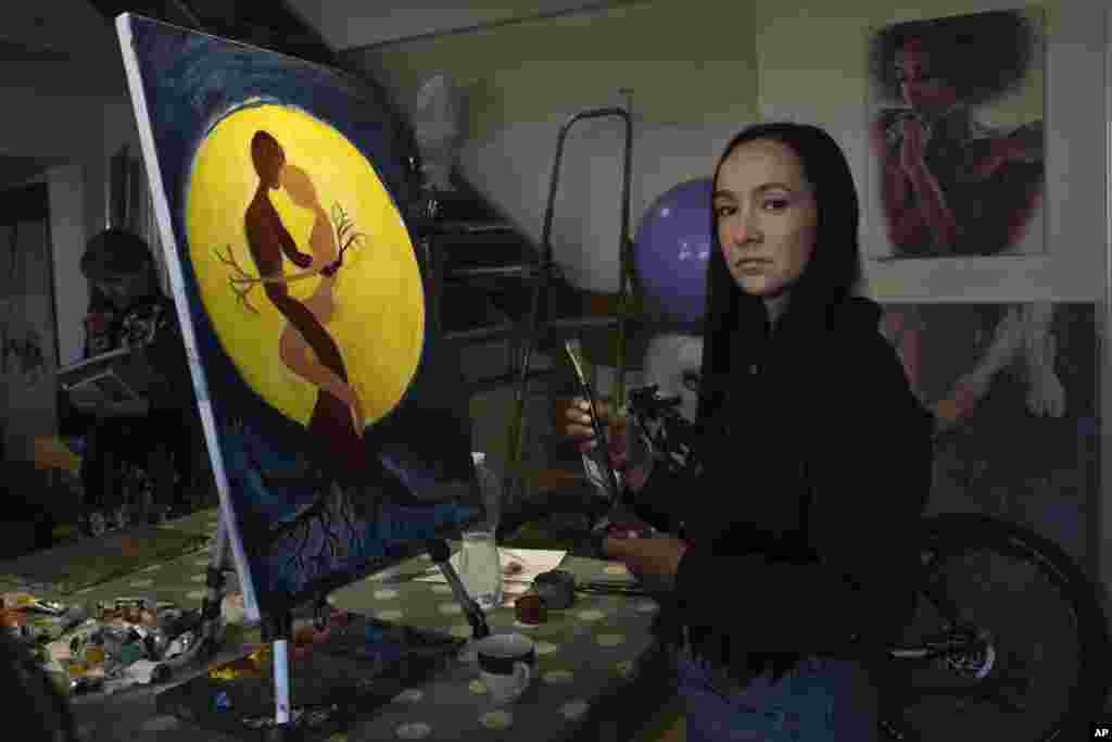 In a Kyiv art studio filled with easels and canvases, Iryna Farion puts the finishing touches on an oil painting that&nbsp;depicts two intertwined trees held together by their roots illuminated by a giant sun. &quot;I feel like it&#39;s me and my husband, who was killed in the war,&quot; Farion says of the trees. &quot;They are like two souls, like two hearts, like one body.&quot; Farion is among thousands of Ukrainian women who have lost their partners in the war Russia launched against their homeland nearly 17 months ago.&nbsp;