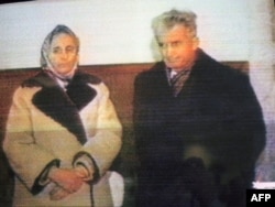 Nicolae Ceausescu (right) and his wife, Elena Ceausescu, face TV cameras on December 25, 1989, during their makeshift trial.