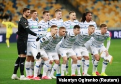 Dynamo Kyiv players pose for a team photo before a Europa League match in Kyiv on March 21, 2021.