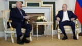 Russian President Vladimir Putin (right) meets with Belarusian ruler Alyaksandr Lukashenka in St. Petersburg on July 23.