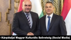 Vasyl Brenzovych (left) with Hungarian Prime Minister Viktor Orban