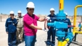 KazTransGas Chairman Kairat Sharipbaev (center) inaugurating new oil wells in Kazakhstan. (file photo)