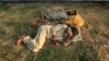 Pakistani drug users sleep after consuming drugs on a roadside in Peshawar, Pakistan. 