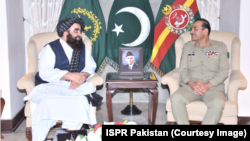 Pakistani Army chief General Asim Munir (right) meets with Amir Khan Muttaqi, the interim foreign minister for the Taliban-led government in Afghanistan, in Rawalpindi, Pakistan, on May 6.
